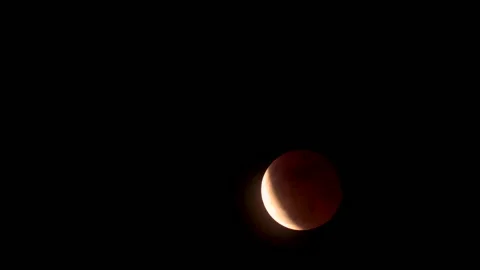 Red Full moon concept. Beautiful full moon on dark Stock Footage 221010274
