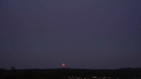 Red Full Moon Set Timelapse Night to Day Stock Footage 138295093