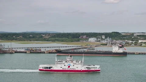Red Funnel Ferry over refinery and Esso Oil Terminal, Southampton, Hampshire, UK Stock-Footage 316145086