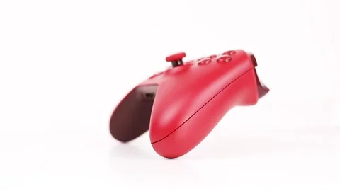 Red game controller isolated on white focus in out Stock Footage 240607661
