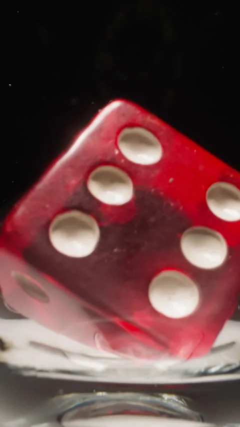 Red gaming cube with white dots floating in transparent glass Stock Footage 307462130