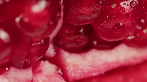 Red garnet close-up macro. Pomegranate fruit. Vitamins. Health food concept Stock Footage 264938346