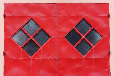 The red gate with diamond-shaped. background Stock Photos