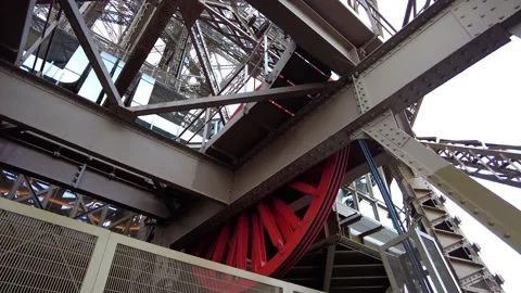 Red Gear Wheel Of Eiffel Tower Lift Rotating. Elevator Mechanism. closeup, Video stock 228894019