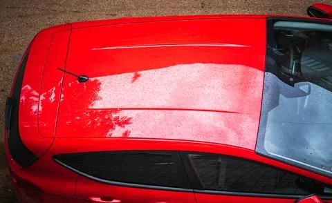 Red generic car top view parked on the street. Hardtop of the red car. Meta.. Stock Photos