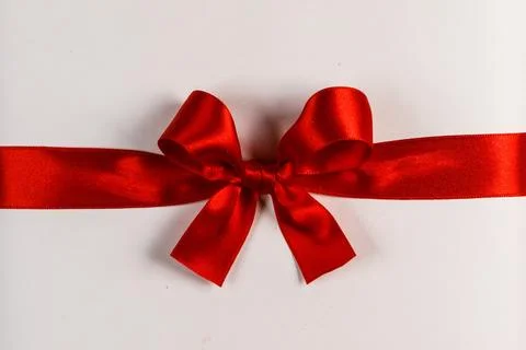 Red gift bow on white Stock Photos