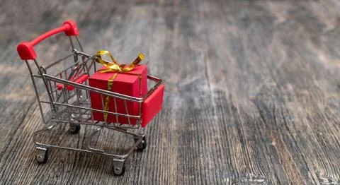Red gift box in the basket. Stock Photos