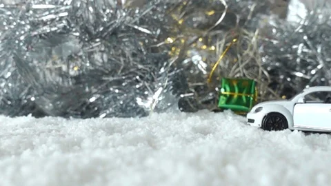 The red gift box falls from the top to the snow ground, 스톡 동영상 114604322