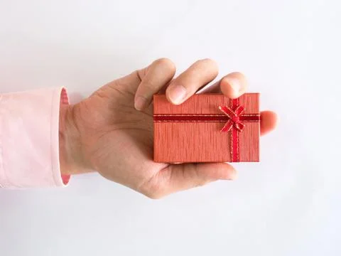 Red gift box on hand Stock Photos