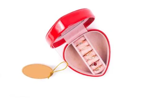 Red gift box in heart shape with rings Stock Photos