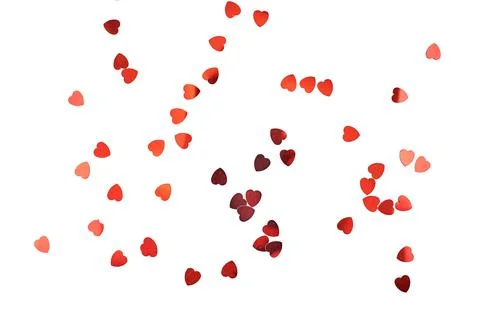 Red gift box with hearts pattern isolated on white background. Stock Photos