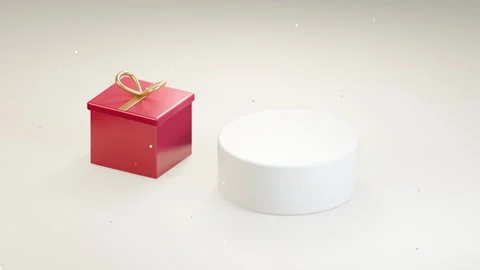 Red gift box opens beside an empty white display pedestal Stock Footage 346168198
