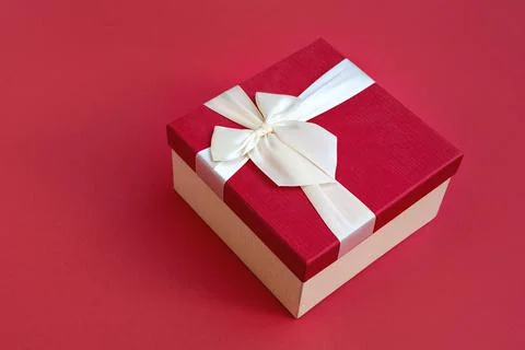 Red gift box on red background Stock Photos