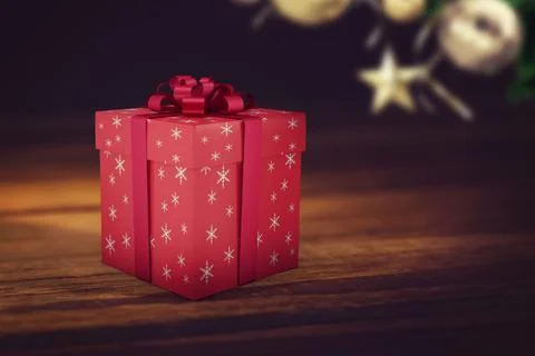 Red gift box is sitting on table in flat design, with snowflake-pattern, red Stock Photos