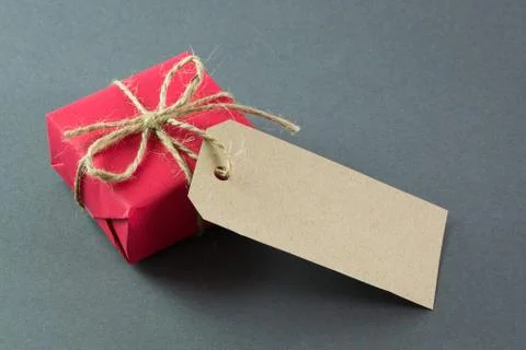 Red gift box with tag Stock Photos