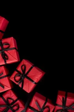Red gift boxes on black Stock Photos