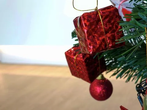 Red gift boxes on Christmas tree. With copy space. Stock Photos