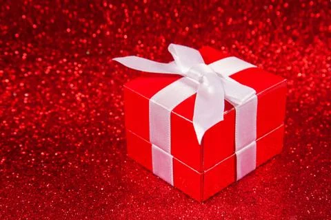 Red gift boxes on glitter red background Stock Photos