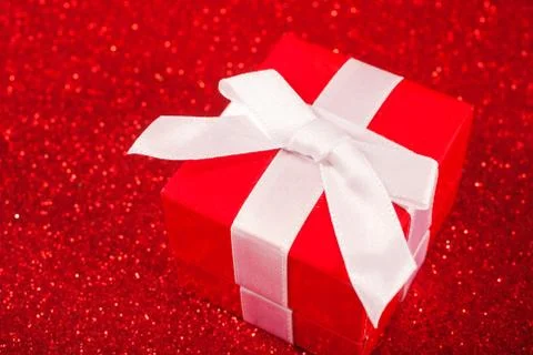 Red gift boxes on glitter red background Stock Photos