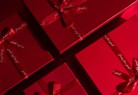 Red gift boxes on a red background Stock Photos