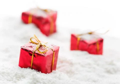 Red gift boxes with white snow shot Stock Photos