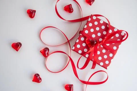 Red giftbox with white polka dots Stock Photos