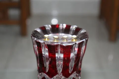 A red glass object with buttons. Stock Photos