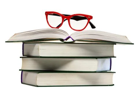 Red glasses on open book Stock Photos