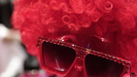 In red glasses wig for valentine for carnival clothes on a mannequin head on Stock Footage 313808798