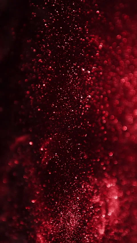Red glitter background in slow motion. Cinematic red particles on black Stock Footage 271172592