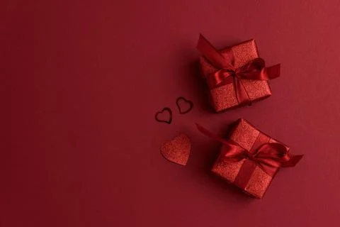 Red Glitter Gift Boxes and Hearts on Festive Background for Valentine's Day.. Stock Photos