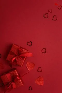 Red Glitter Gift Boxes and Hearts on Festive Background for Valentine's Day.. Foto stock