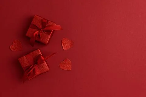 Red Glitter Gift Boxes and Hearts on Festive Background for Valentine's Day.. Stock Photos
