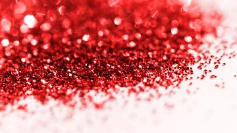 Red glitter on light background - macro photo Stock Photos