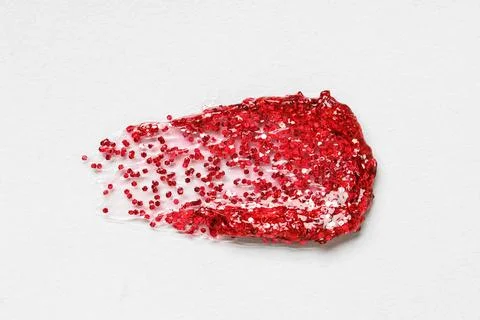 Red glitter stroke on grey background Stock Photos