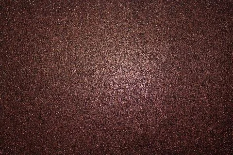 Red glittery background with light in the centre Stock Photos