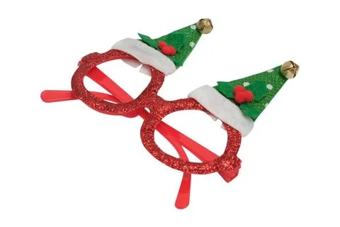 Red glittery spectacle with elf hat decoration on white background. Festive.. Stock Photos