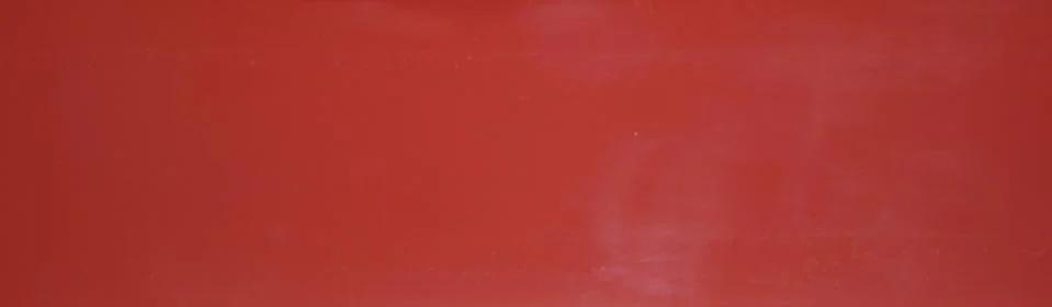 Red glossy background horizontally positioned. Stock Photos