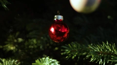 Red glossy ball. Close-up of a Christmas ball on a Christmas tree with glare Stock Footage 296401465