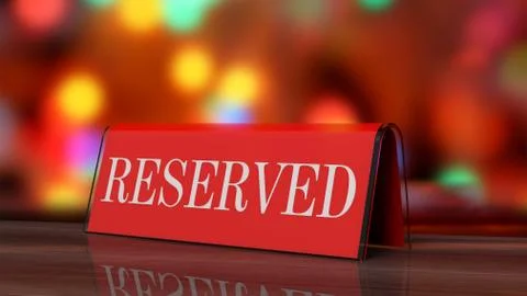 Red glossy reservation sign on wooden surface, with festive background. Stock Photos