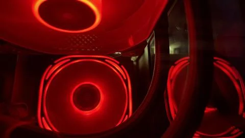 Red glowing computer fans providing vital cooling within a high performance P Stock Photos