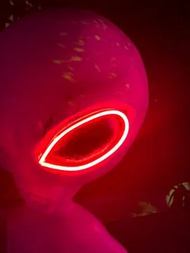The red glowing eye of an alien. Stock Photos