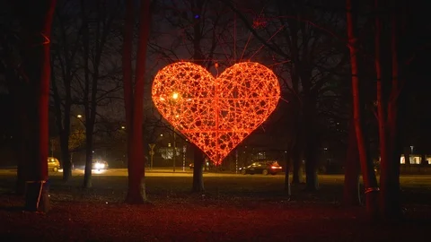 Red glowing heart in a roundabout Stock Footage 85854963