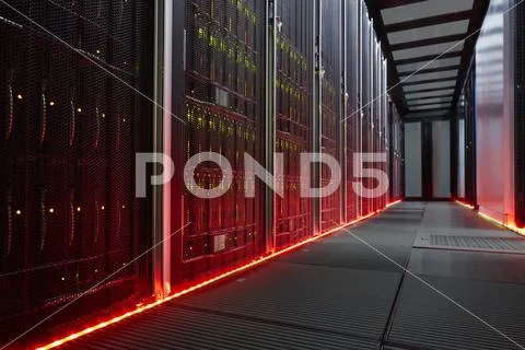 Red glowing panels in dark server room Stock Photos