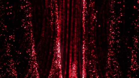 Red glowing particle stream flowing against black background video footage Stock Footage 327593196