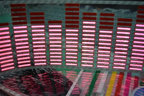 Red glowing plastic equalizer, electronics glowing to the music. 스톡 사진