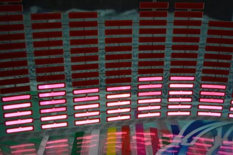 Red glowing plastic equalizer, electronics glowing to the music. 写真素材