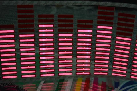 Red glowing plastic equalizer, electronics glowing to the music. 스톡 사진