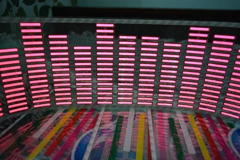 Red glowing plastic equalizer, electronics glowing to the music. 스톡 사진