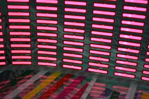 Red glowing plastic equalizer, electronics glowing to the music. 스톡 사진